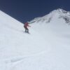 Snowboarding Shastina after a summit climb of Mt Shasta.